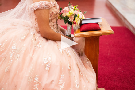 Image of quinceañera praying in traditional hispanic culture